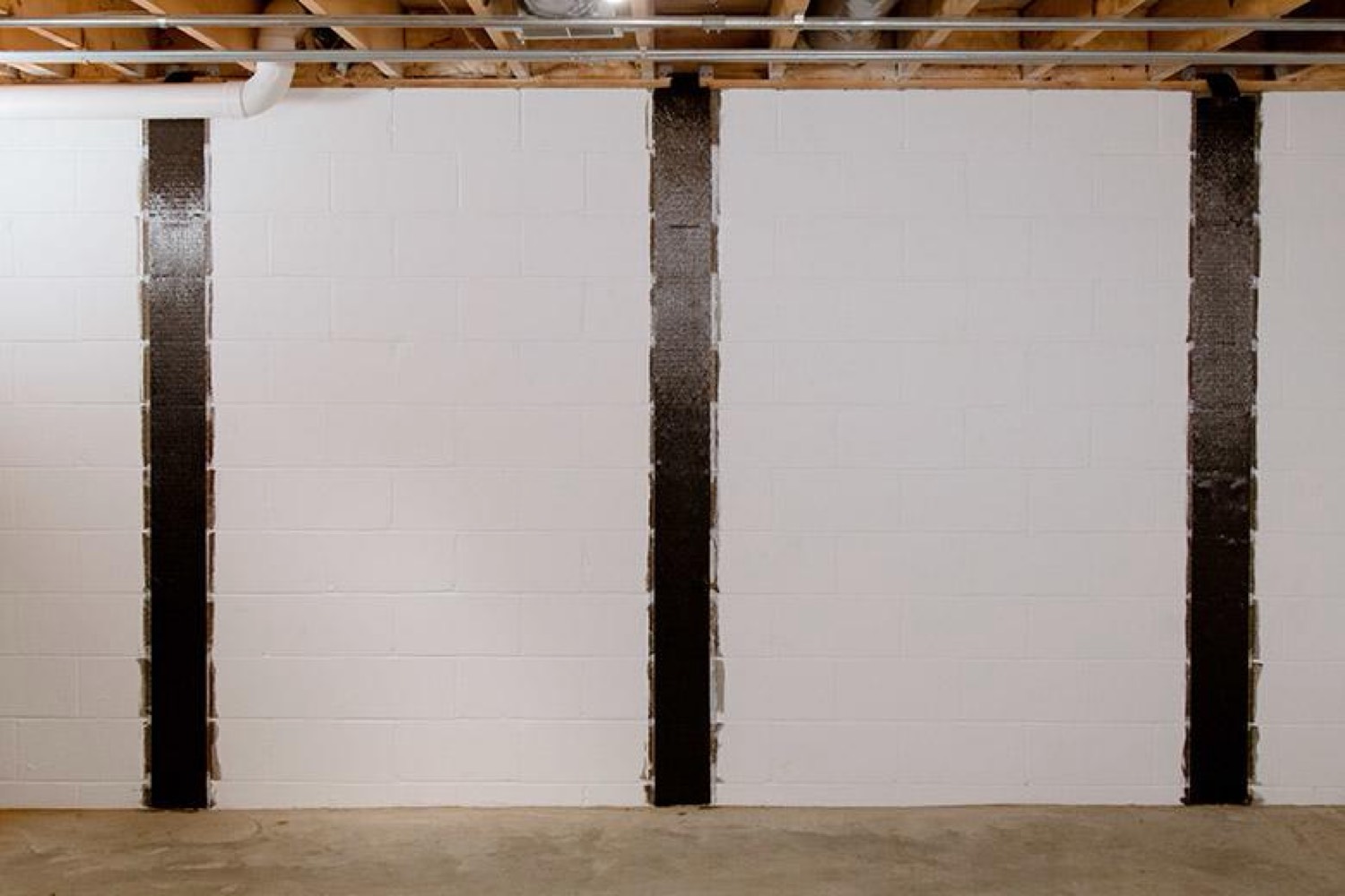 Painted block wall with three carbon fiber straps